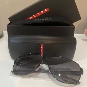 Prada men's sunglasses received them as a gift. They were too big and never worn